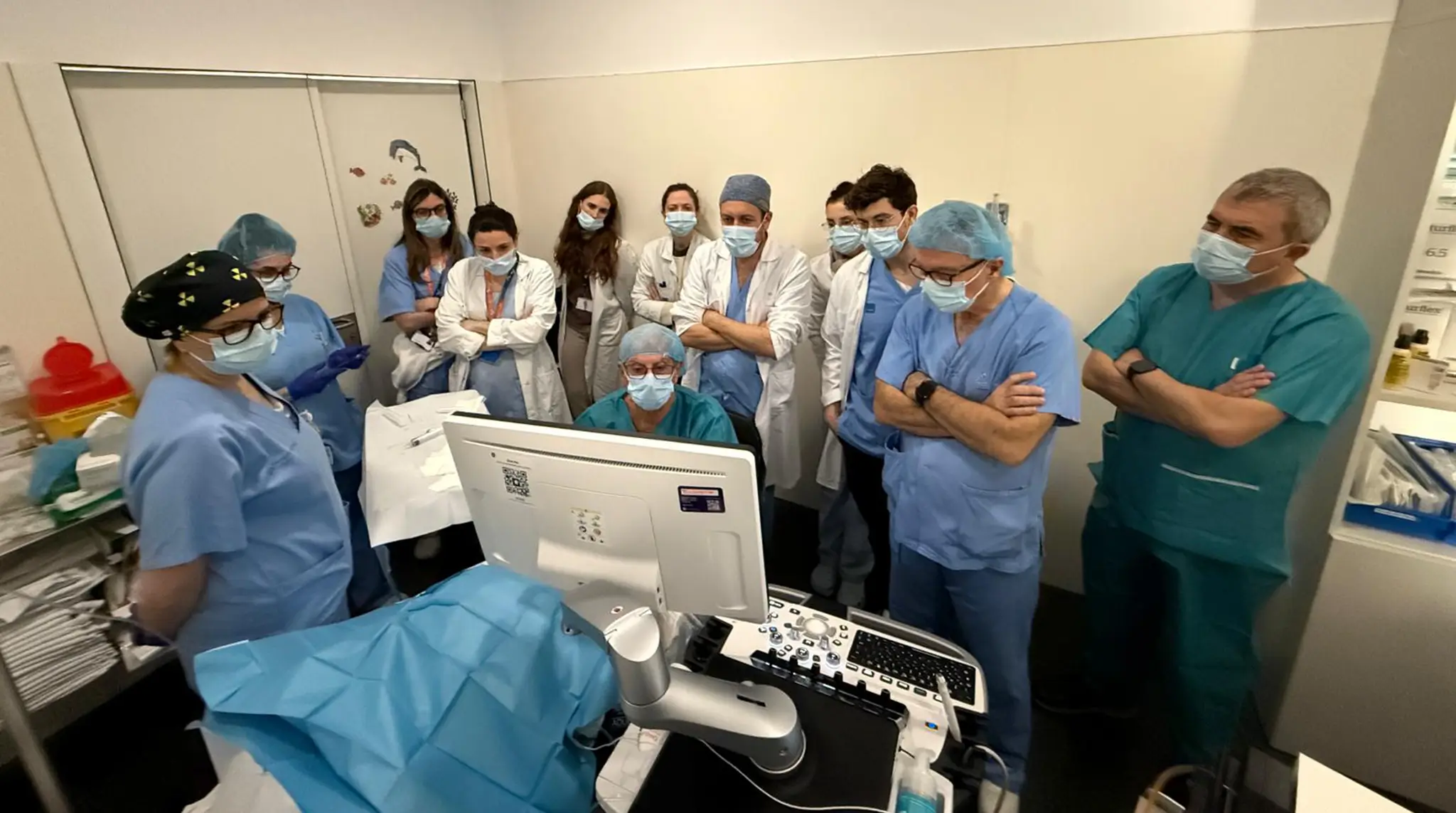 Doctor performing a procedural demonstrations for attending physicians.